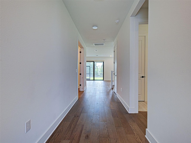 12705 Pinnacle Ln, Venice, FL 34293 - hallway with dark wood-type flooring and baseboards