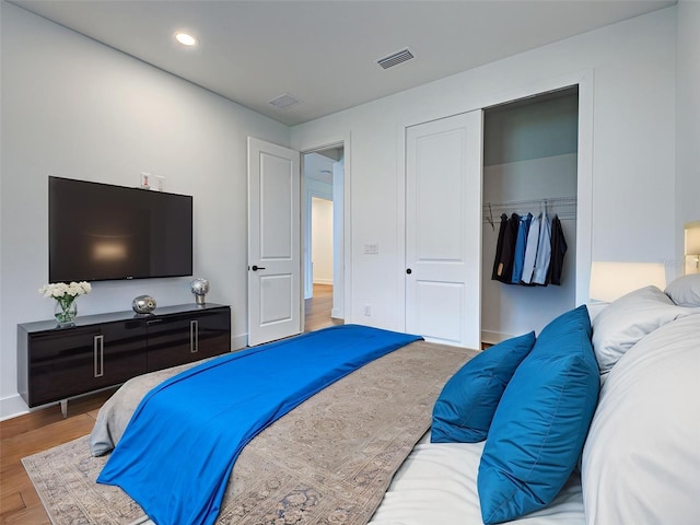 12705 Pinnacle Ln, Venice, FL 34293 - bedroom with a closet, wood finished floors, and recessed lighting
