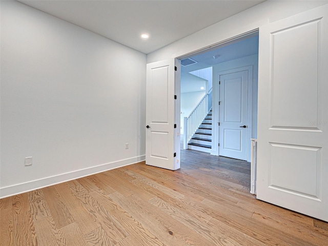 12705 Pinnacle Ln, Venice, FL 34293 - unfurnished room with light wood-type flooring, baseboards, and recessed lighting