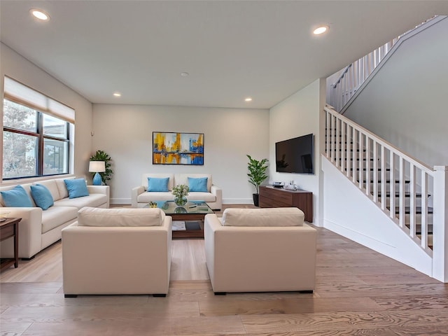12705 Pinnacle Ln, Venice, FL 34293 - living room with stairs, recessed lighting, wood finished floors, and baseboards