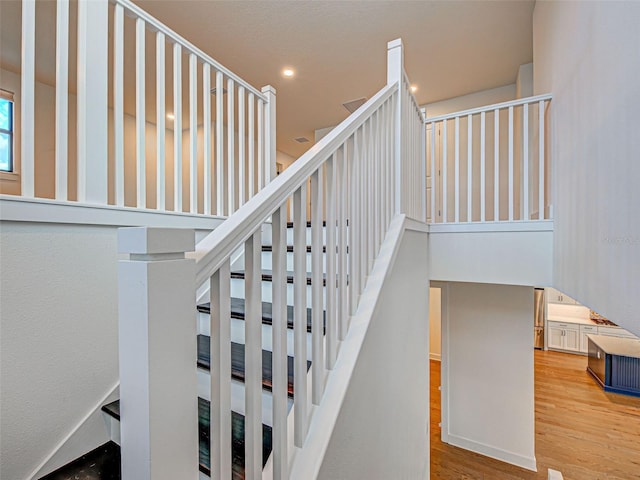 12705 Pinnacle Ln, Venice, FL 34293 - stairway with wood finished floors