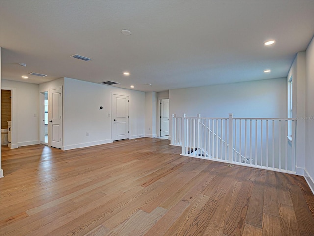 12705 Pinnacle Ln, Venice, FL 34293 - unfurnished room with light wood-type flooring, baseboards, and recessed lighting