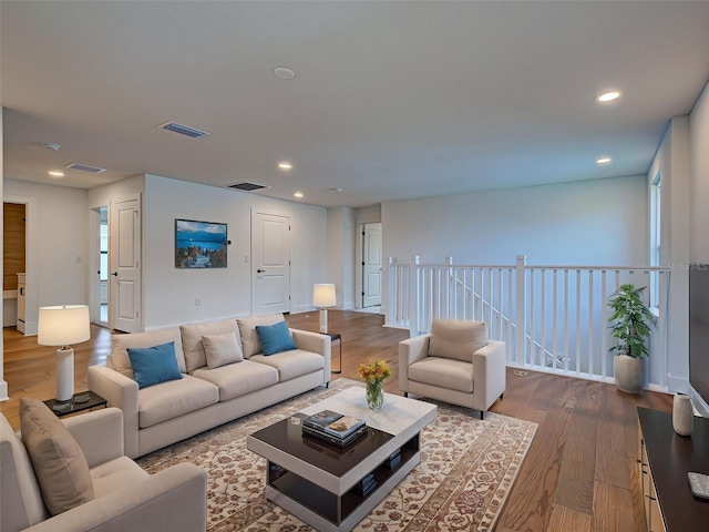 12705 Pinnacle Ln, Venice, FL 34293 - living area featuring dark wood finished floors and recessed lighting