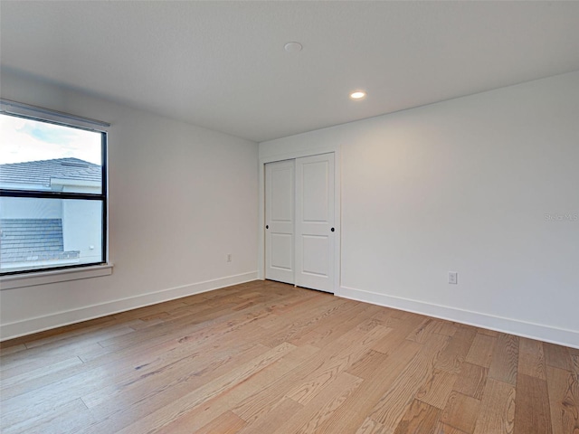 12705 Pinnacle Ln, Venice, FL 34293 - unfurnished room featuring light wood-style flooring, baseboards, and recessed lighting