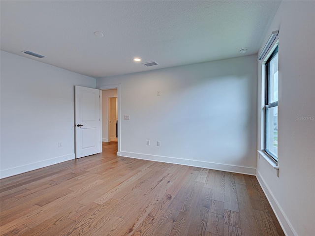 12705 Pinnacle Ln, Venice, FL 34293 - empty room with light wood-type flooring, baseboards, and recessed lighting