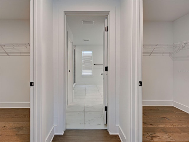 12705 Pinnacle Ln, Venice, FL 34293 - hallway featuring wood finished floors and baseboards