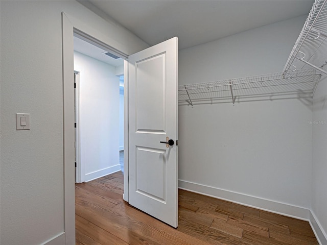 12705 Pinnacle Ln, Venice, FL 34293 - walk in closet with wood finished floors