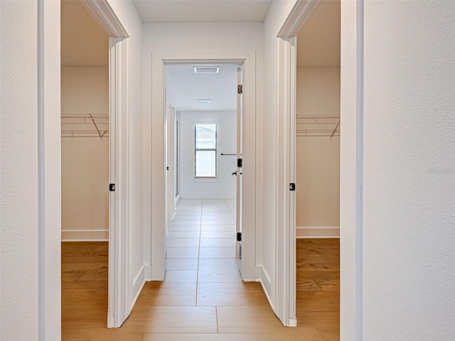 12705 Pinnacle Ln, Venice, FL 34293 - hall featuring light wood-style floors and baseboards