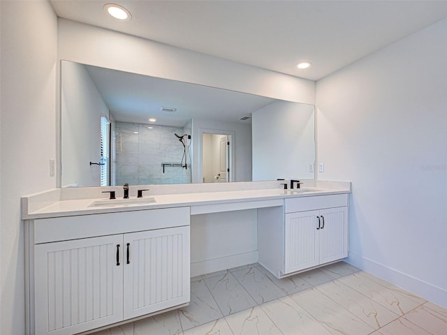12705 Pinnacle Ln, Venice, FL 34293 - full bathroom with marble look tiles, double vanity, a marble finish shower, recessed lighting, and baseboards