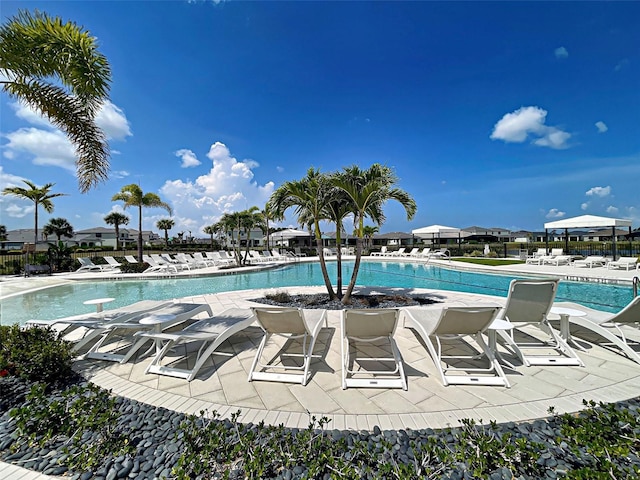 12705 Pinnacle Ln, Venice, FL 34293 - community pool featuring a patio area