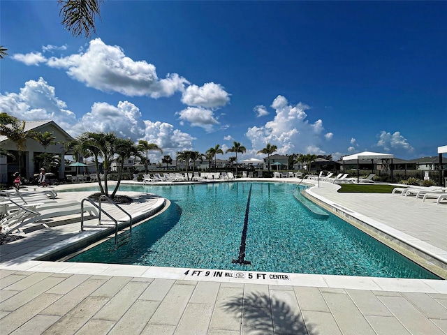 12705 Pinnacle Ln, Venice, FL 34293 - community pool with a patio area