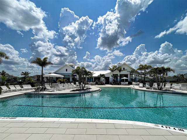 12705 Pinnacle Ln, Venice, FL 34293 - community pool featuring a patio