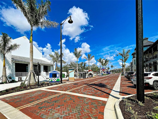 12705 Pinnacle Ln, Venice, FL 34293 - view of decorative road with street lights, sidewalks, and curbs