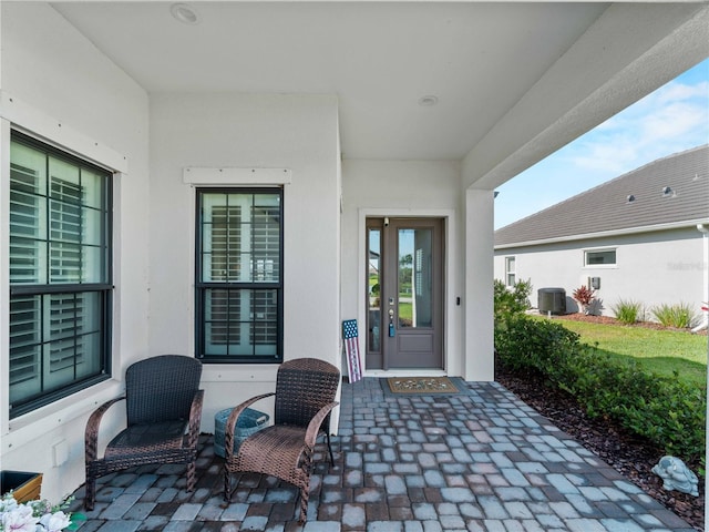 13056 Steinhatchee Loop, Venice, FL 34293 - property entrance with stucco siding and cooling unit