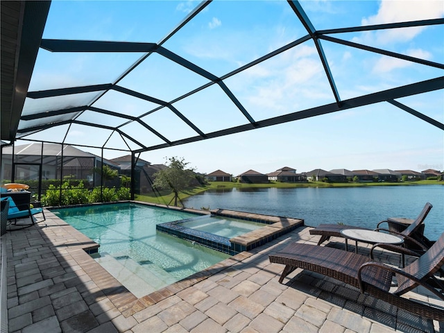13056 Steinhatchee Loop, Venice, FL 34293 - view of pool featuring a patio, a pool with connected hot tub, a water view, and a residential view