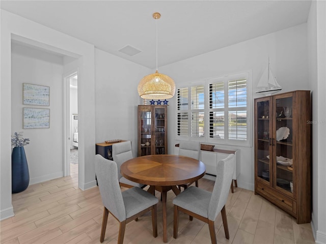 13056 Steinhatchee Loop, Venice, FL 34293 - dining area featuring baseboards and light wood-style flooring