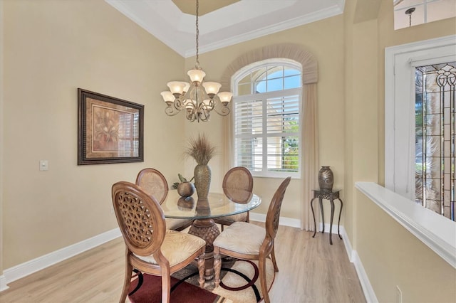 5018 Bella Terra Dr, Venice, FL 34293 - dining room with light wood-style flooring, healthy amount of natural light, crown molding, and a chandelier