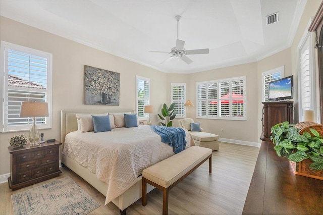 5018 Bella Terra Dr, Venice, FL 34293 - bedroom featuring wood finished floors, ornamental molding, a ceiling fan, and a raised ceiling
