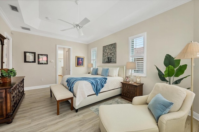 5018 Bella Terra Dr, Venice, FL 34293 - bedroom with light wood finished floors, a tray ceiling, crown molding, and a ceiling fan