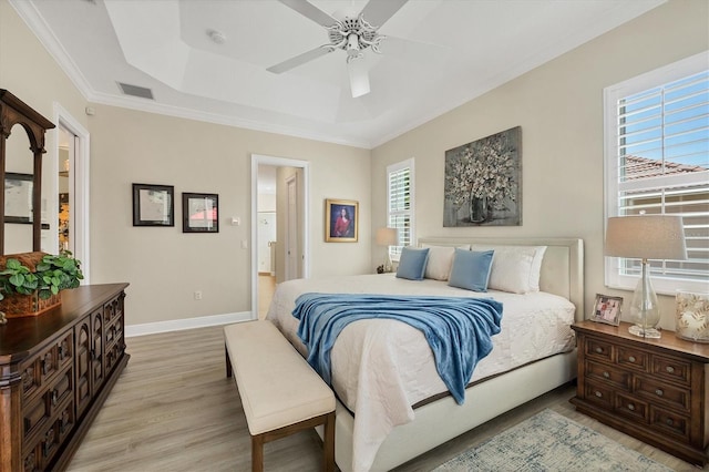 5018 Bella Terra Dr, Venice, FL 34293 - bedroom featuring light wood-type flooring, a raised ceiling, a ceiling fan, and ornamental molding