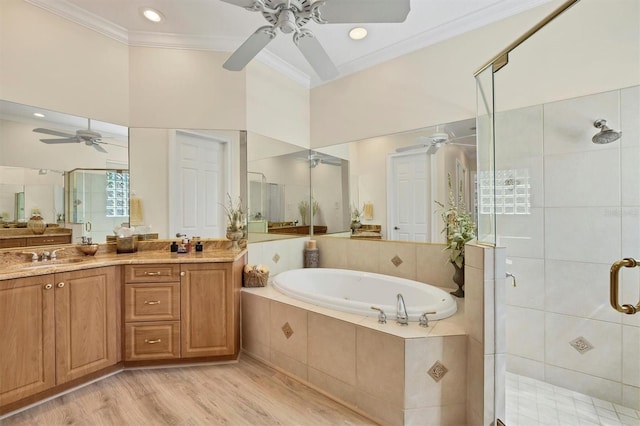 5018 Bella Terra Dr, Venice, FL 34293 - full bath featuring a ceiling fan, a stall shower, crown molding, a bath, and vanity