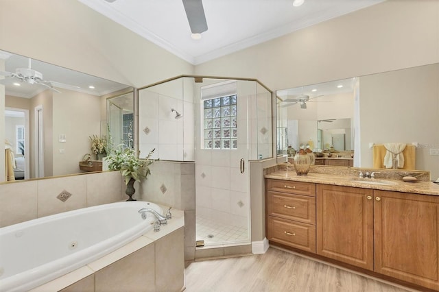 5018 Bella Terra Dr, Venice, FL 34293 - bathroom with ceiling fan, ornamental molding, a whirlpool tub, a stall shower, and vanity