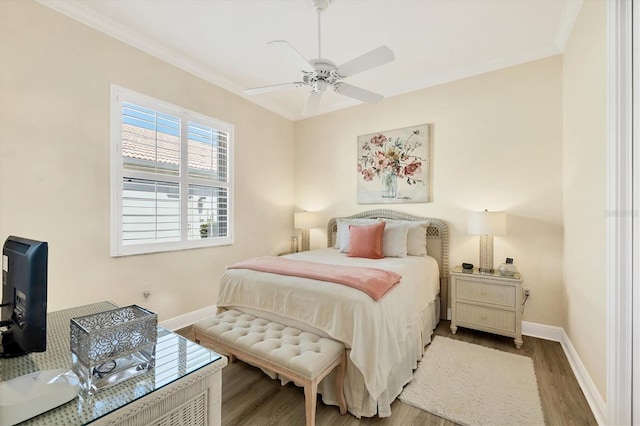 5018 Bella Terra Dr, Venice, FL 34293 - bedroom featuring wood finished floors, crown molding, and a ceiling fan