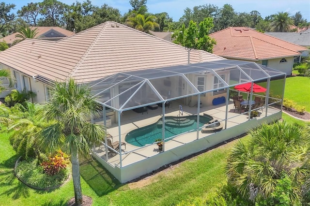 5018 Bella Terra Dr, Venice, FL 34293 - rear view of house featuring a patio area, a yard, a lanai, and an outdoor pool