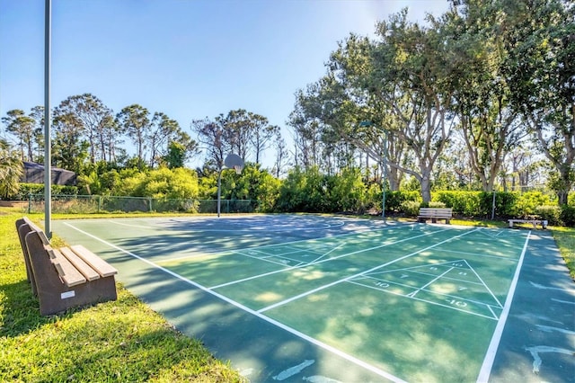 5018 Bella Terra Dr, Venice, FL 34293 - view of tennis court with shuffleboard and view of scattered trees