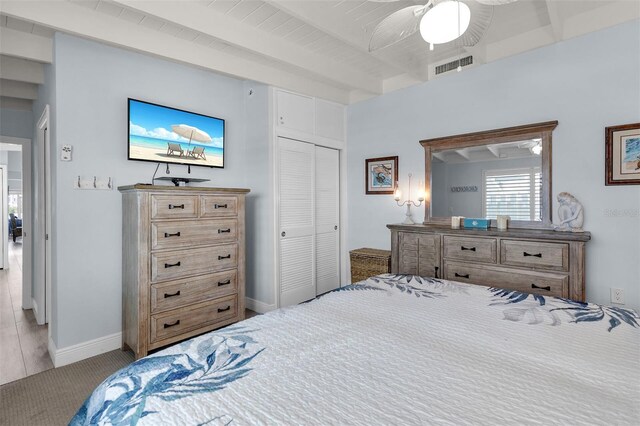 8 Sadowski Cswy, Key Colony Beach, FL 33051 - carpeted bedroom with beam ceiling, a closet, ceiling fan, and baseboards