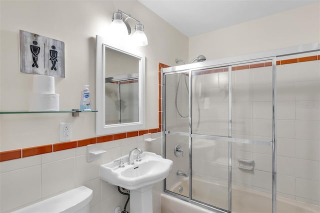 8 Sadowski Cswy, Key Colony Beach, FL 33051 - bathroom featuring toilet, shower / bath combination with glass door, tile walls, and a sink