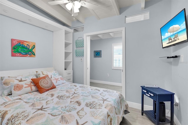 8 Sadowski Cswy, Key Colony Beach, FL 33051 - bedroom featuring beamed ceiling, light wood-type flooring, baseboards, and ceiling fan