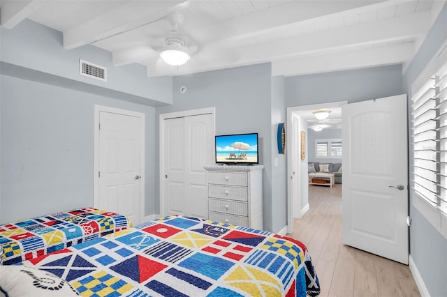 8 Sadowski Cswy, Key Colony Beach, FL 33051 - bedroom featuring beamed ceiling, light wood-type flooring, a closet, baseboards, and ceiling fan