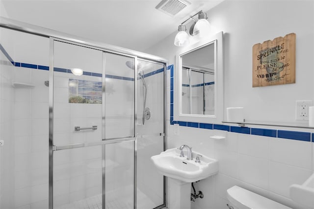 8 Sadowski Cswy, Key Colony Beach, FL 33051 - full bath with tile walls, toilet, and a shower stall
