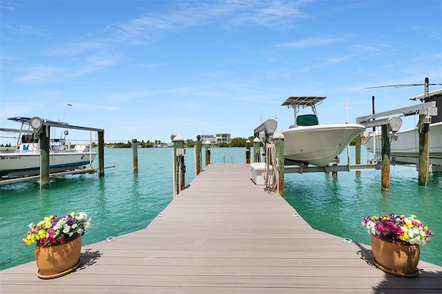 8 Sadowski Cswy, Key Colony Beach, FL 33051 - dock area featuring boat lift and a water view