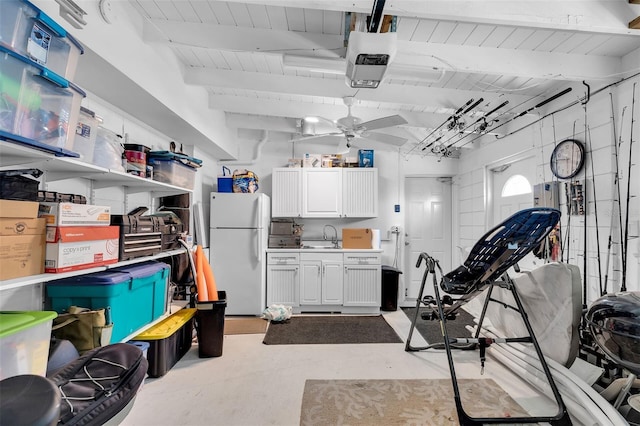 8 Sadowski Cswy, Key Colony Beach, FL 33051 - garage with freestanding refrigerator, ceiling fan, a sink, and wood ceiling