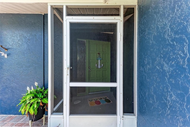 5207 5th Avenue Dr NW, Bradenton, FL 34209 - doorway to property featuring stucco siding