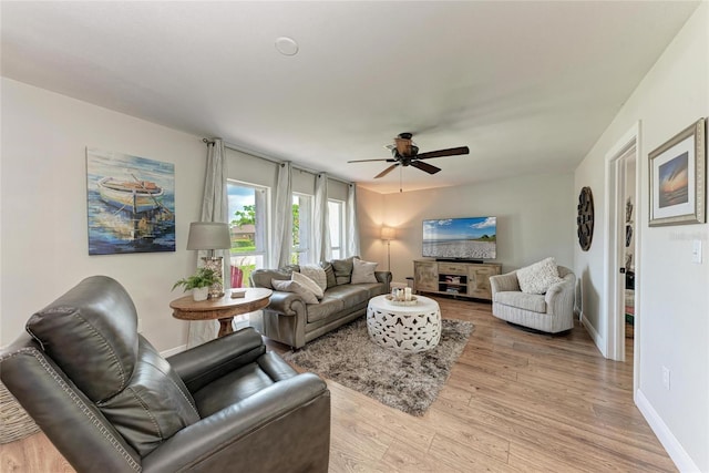 5207 5th Avenue Dr NW, Bradenton, FL 34209 - living area featuring light wood-style floors, a ceiling fan, and baseboards