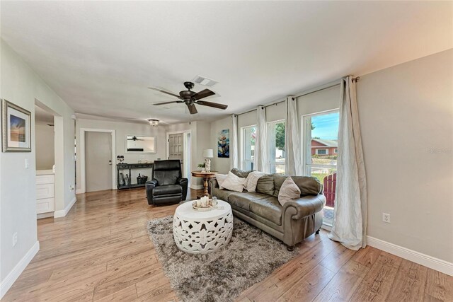 5207 5th Avenue Dr NW, Bradenton, FL 34209 - living area with light wood-style floors, ceiling fan, and baseboards