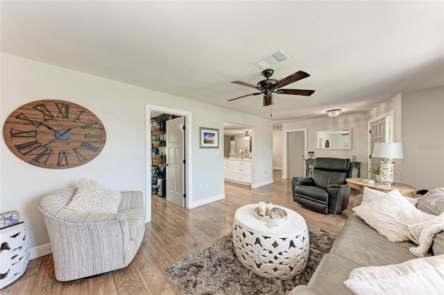 5207 5th Avenue Dr NW, Bradenton, FL 34209 - living area with ceiling fan, light wood finished floors, and baseboards