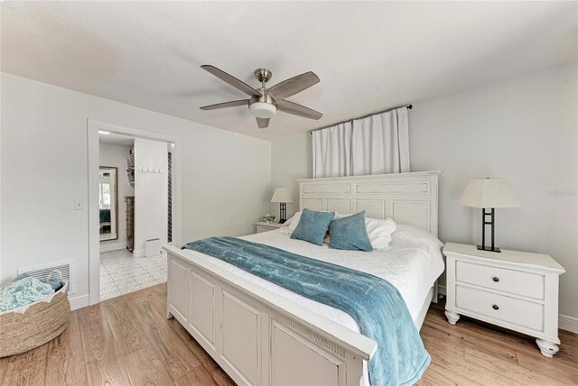 5207 5th Avenue Dr NW, Bradenton, FL 34209 - bedroom featuring light wood-style flooring, baseboards, and a ceiling fan