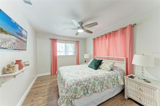 5207 5th Avenue Dr NW, Bradenton, FL 34209 - bedroom with wood finished floors, baseboards, and ceiling fan
