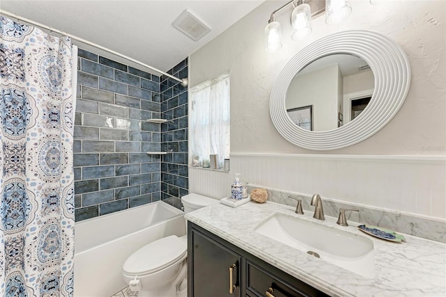 5207 5th Avenue Dr NW, Bradenton, FL 34209 - full bath with vanity, toilet, shower / bath combo, and wainscoting