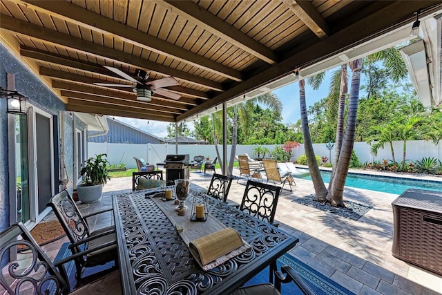 5207 5th Avenue Dr NW, Bradenton, FL 34209 - fenced backyard with a patio area, outdoor dining area, and a ceiling fan