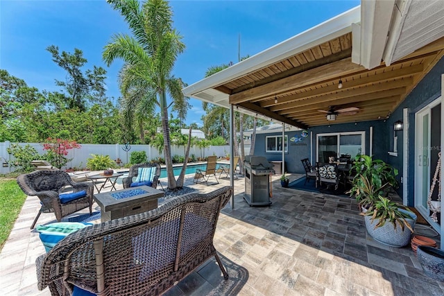 5207 5th Avenue Dr NW, Bradenton, FL 34209 - fenced backyard featuring a patio area, ceiling fan, outdoor dining space, and a grill