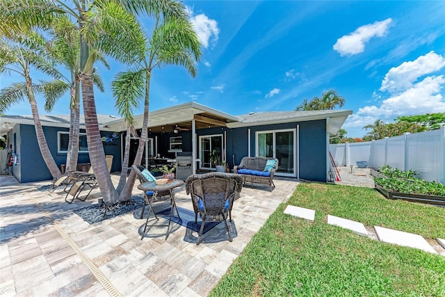 5207 5th Avenue Dr NW, Bradenton, FL 34209 - back of property featuring stucco siding, an outdoor living space, a patio, and ceiling fan