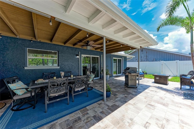 5207 5th Avenue Dr NW, Bradenton, FL 34209 - view of patio with ceiling fan, outdoor dining area, a grill, a gate, and a fire pit