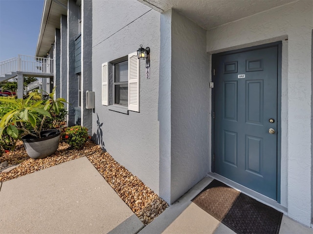 25050 Sandhill Blvd Unit 6A3, Punta Gorda, FL 33983 - doorway to property featuring stucco siding