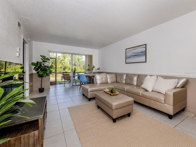25050 Sandhill Blvd Unit 6A3, Punta Gorda, FL 33983 - living area with light tile patterned floors and a textured ceiling