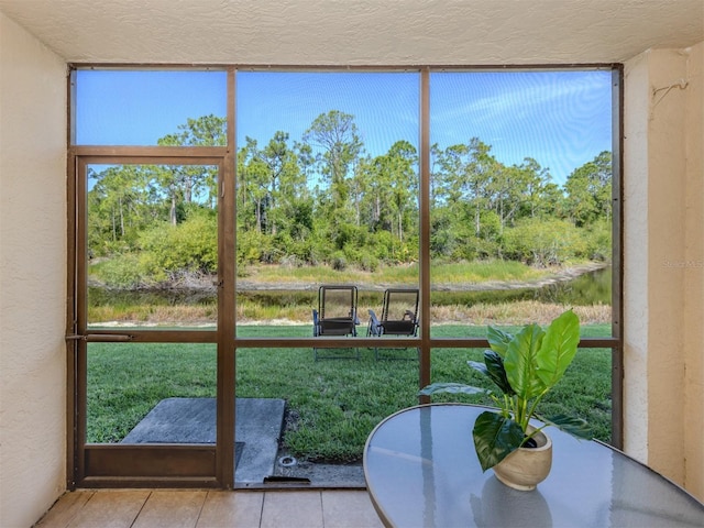 25050 Sandhill Blvd Unit 6A3, Punta Gorda, FL 33983 - sunroom featuring view of scattered trees